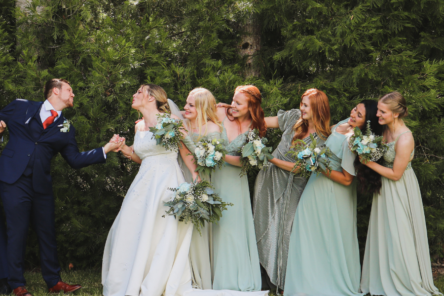 bridesmaids with groom